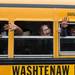 Students wave goodbye to faculty members as their buses pull away form the school, Friday June 7.
Courtney Sacco I AnnArbor.com  